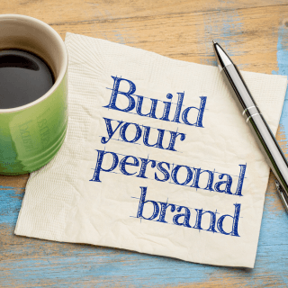 Coffee Mug, Pen and napkin with words Build your personal brand Homepage image